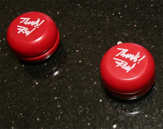Two bright red AA yoyos