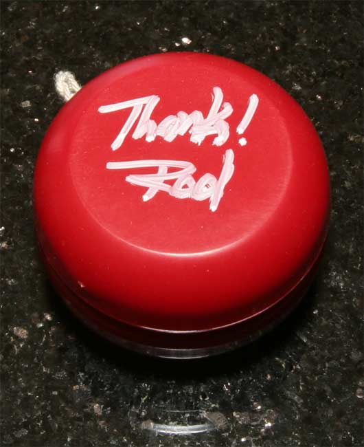 One hand-signed bright red AA yoyo