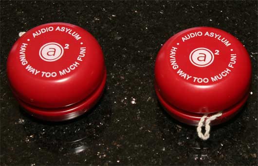 Two bright red AA yoyos